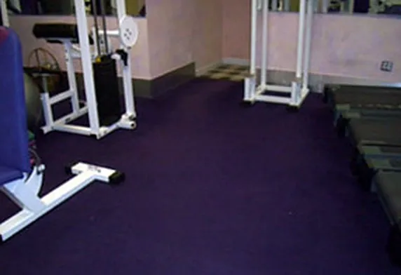 The same gym floor after REA Floors extracted the water and restored it